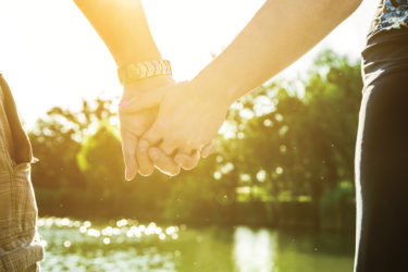 Couple holding hands