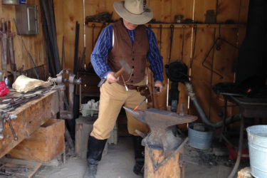 Man working on anvil