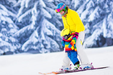 Mother and child skiing