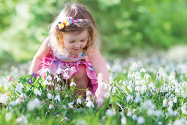 Little girl looking for Easter eggs