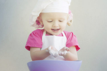 Child playing with flour