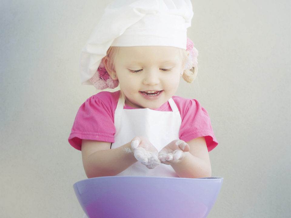 Child playing with flour
