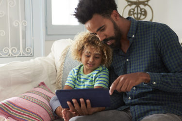 Father and son on couch
