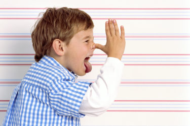 Boy sticking tongue out