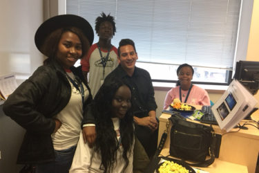 Teens in a room talking