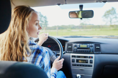 Teen driving car
