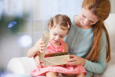 Mother and child opening present