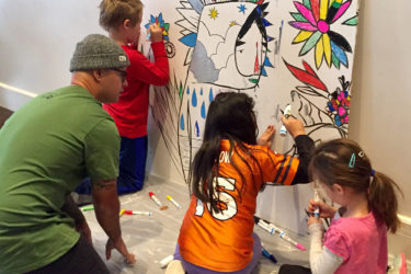 Kids working on mural