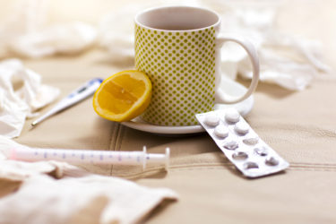 Hot tea for colds, handkerchiefs and thermometer