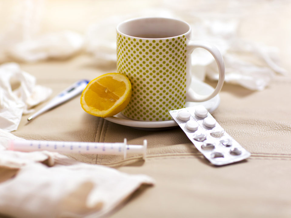 Hot tea for colds, handkerchiefs and thermometer