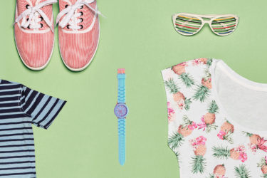 Secondhand clothing isolated on green