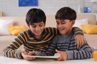 Boys playing on tablet