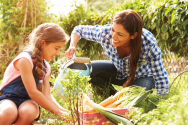 Mother and daughter in garden