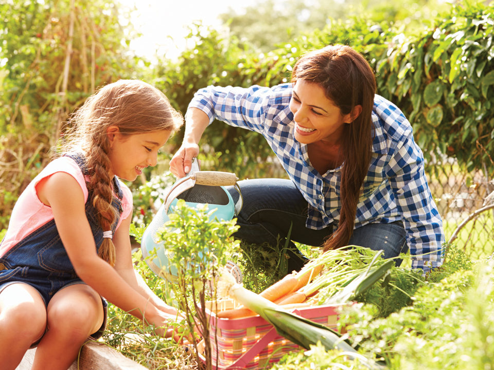 Mother and daughter in garden