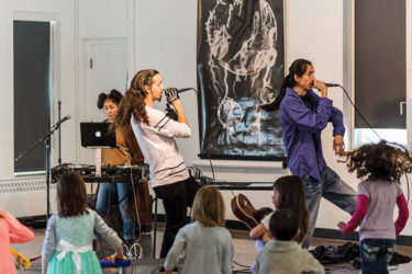 Group performing music at Warm Cookies of the Revolution