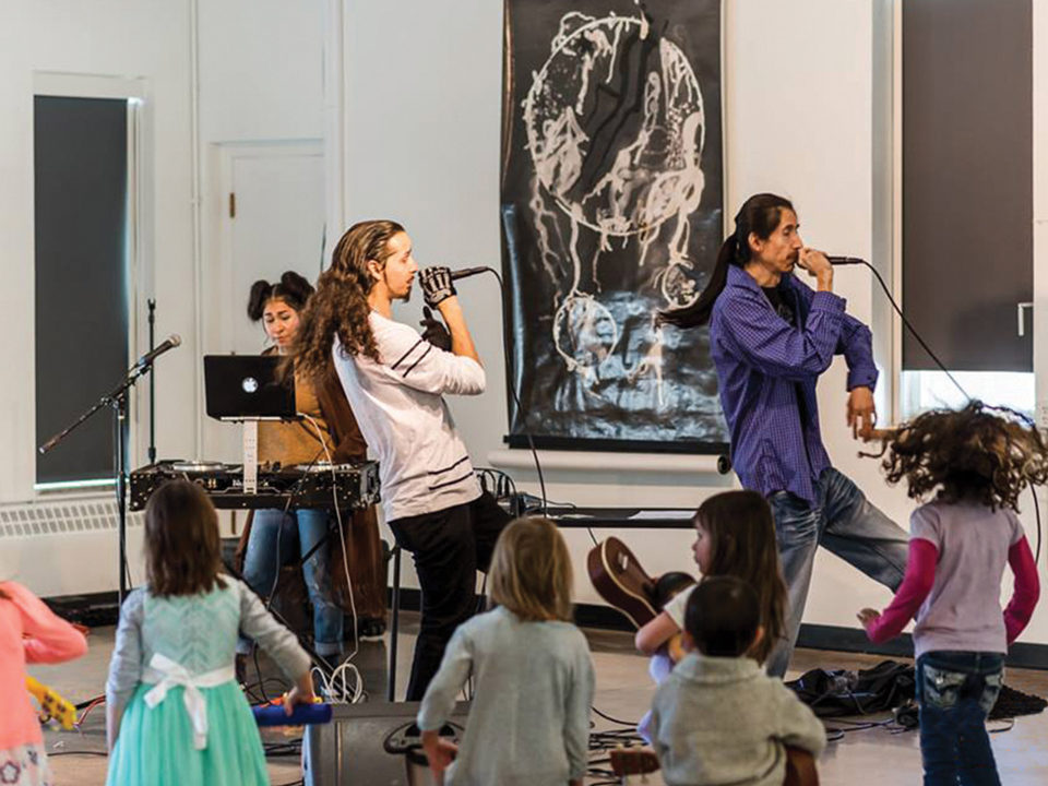 Group performing music at Warm Cookies of the Revolution