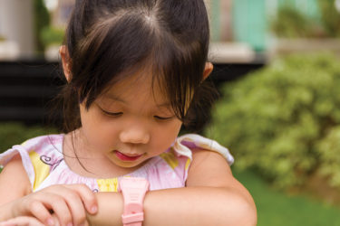 Girl checking smart watch