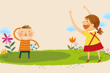 Two children playing with a ball outdoors