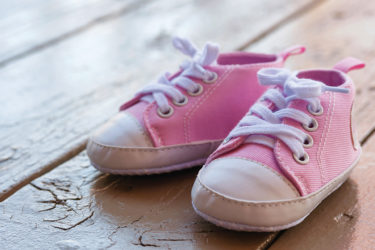 Pink shoes on hardwood floor