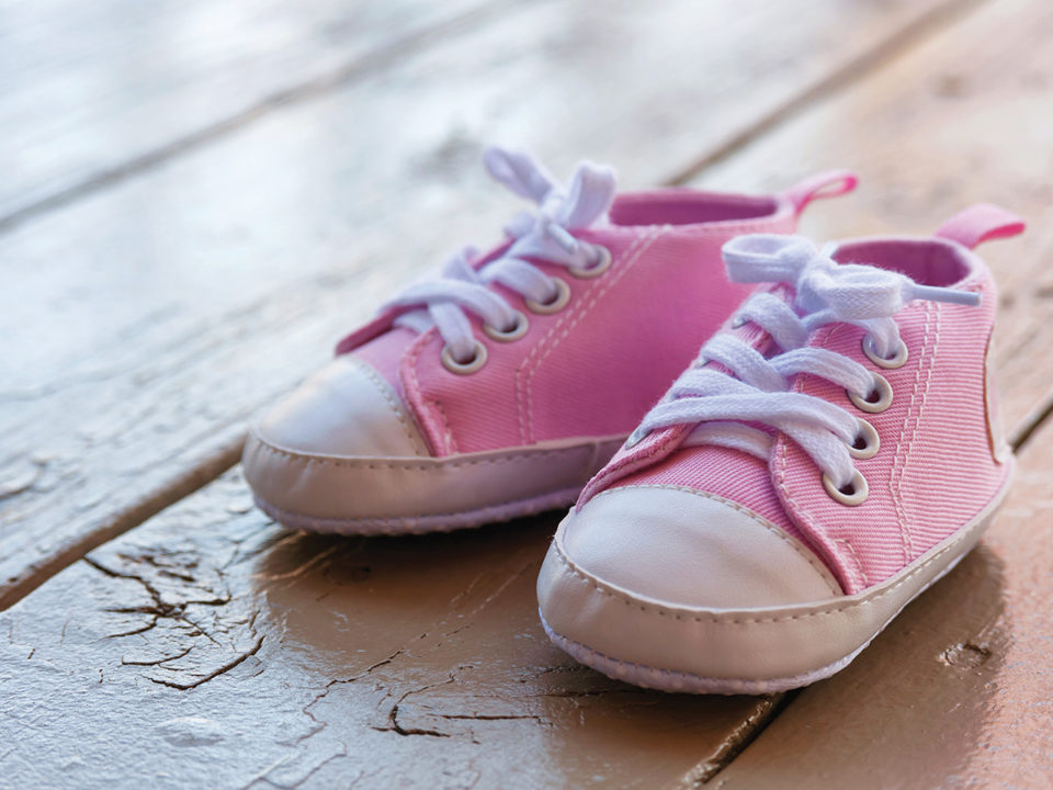 Pink shoes on hardwood floor