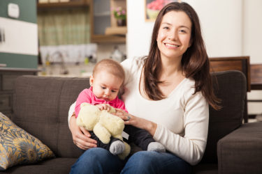 Mother and baby on couch