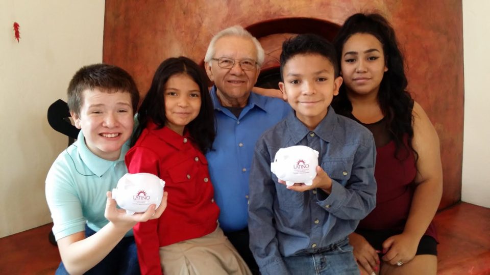 Ron Montoya and family with piggy banks