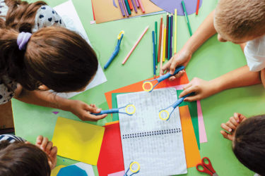 Children working on project in flipped classroom