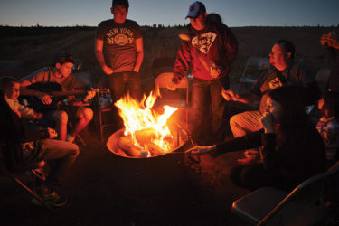 Military families around a campfire
