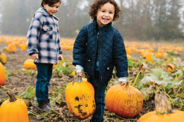 Children in a pumpkin patch