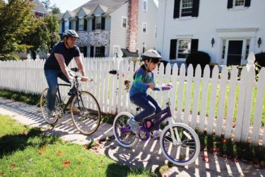 father and daughter biking