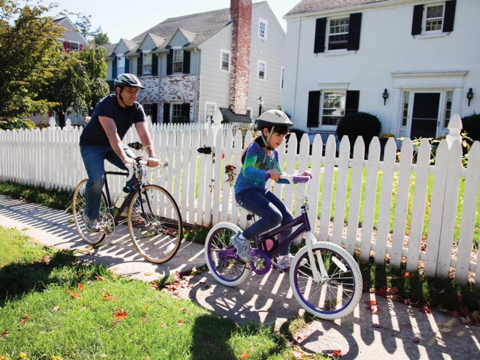 father and daughter biking