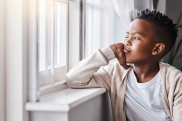 Child looking out window