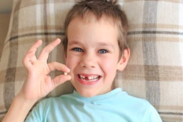 boy with tooth