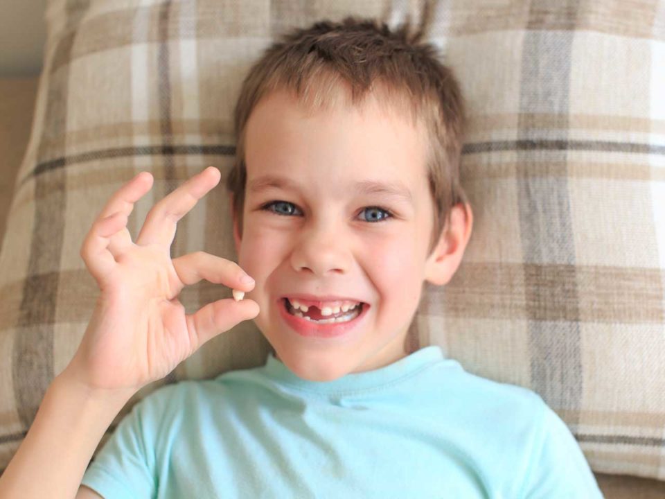 boy with tooth
