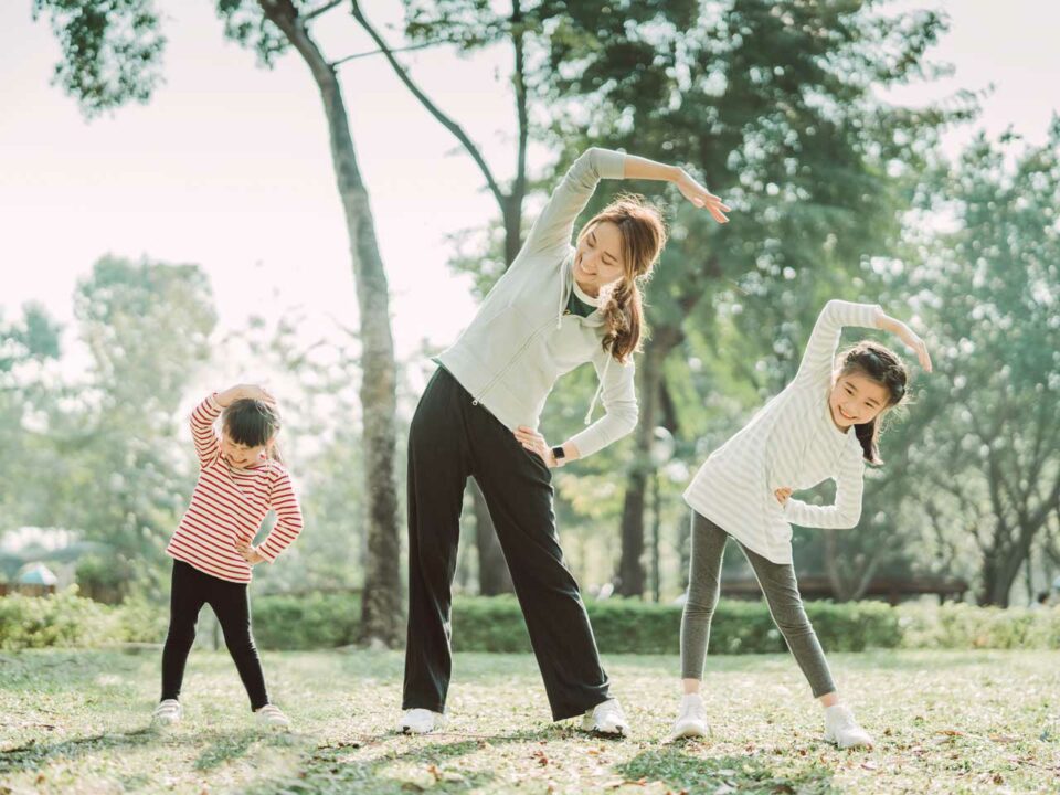 Mom doing yoga with children