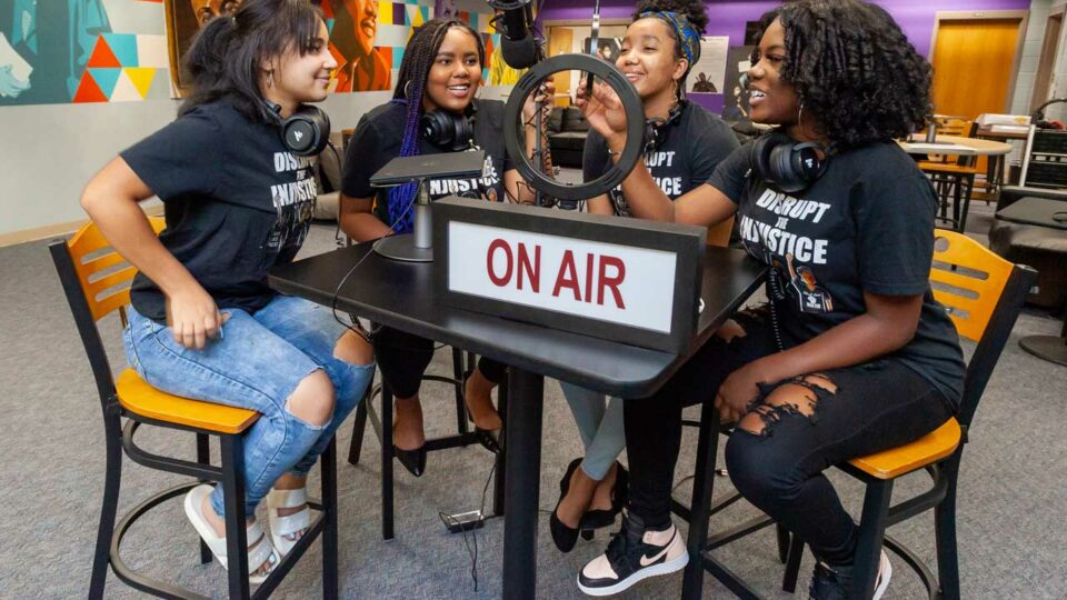 Students recording podcast