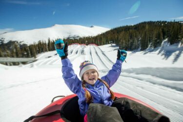 Girl in tube in mountains
