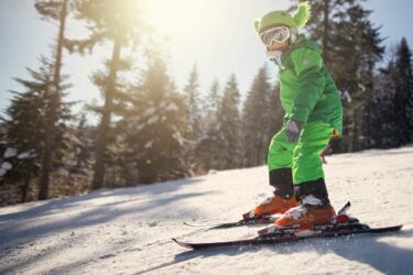 Child skiing on hill