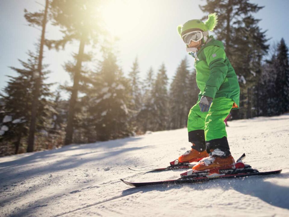 Child skiing on hill