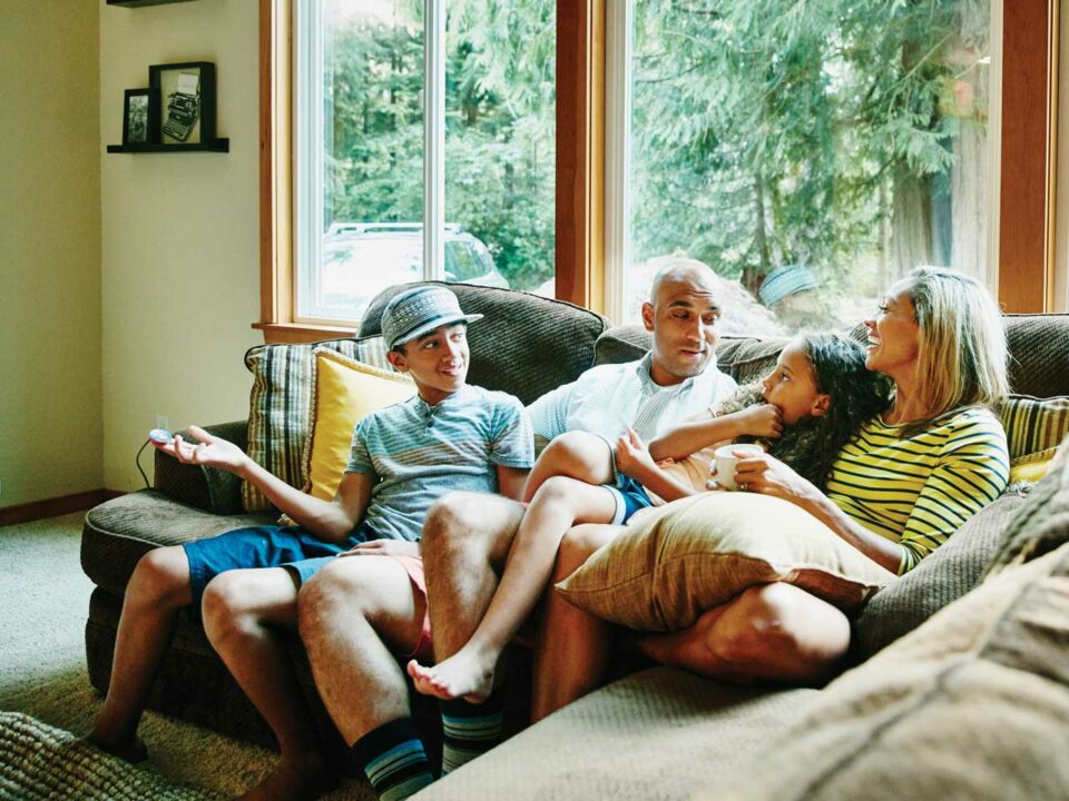 Family talking on a couch