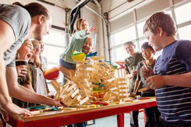 Children playing with wood pieces