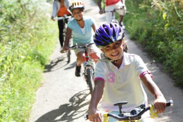 Family riding bikes