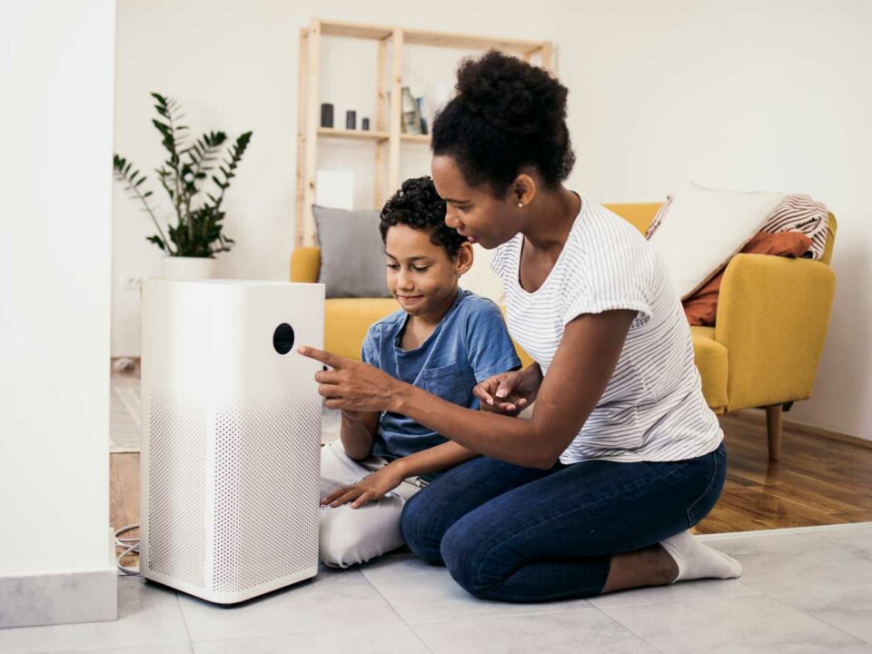 Mother and child with air purifier