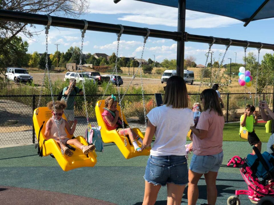 Show example of wheelchair swings at LuBird's Light Playground.