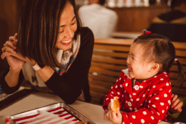 Mother and toddler at restaurant