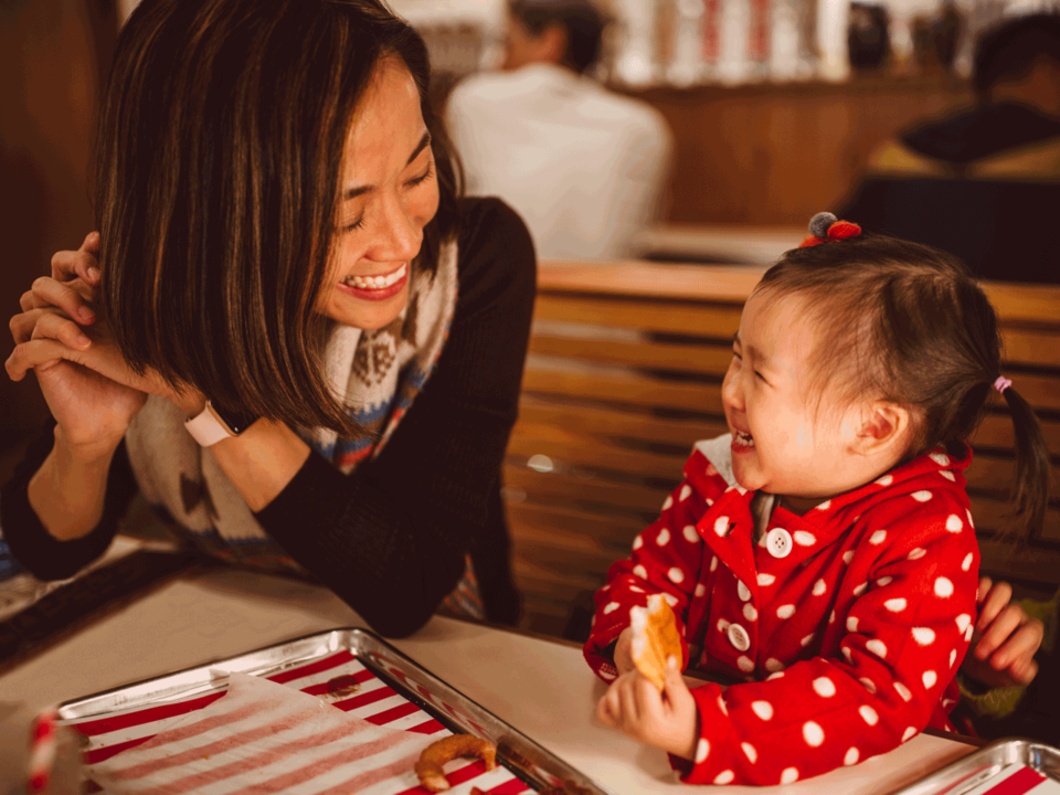 Mother and toddler at restaurant