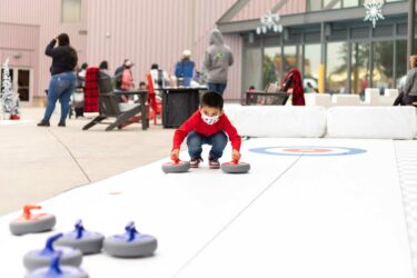 Child curling on ice