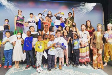 Group of children with backdrop