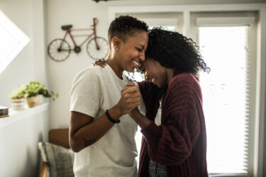 Couple dancing in living room