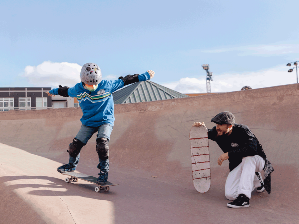 child during skateboarding lesson
